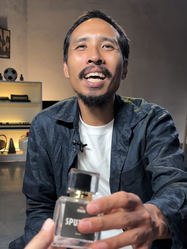 Creator holding a Pikutin bottle